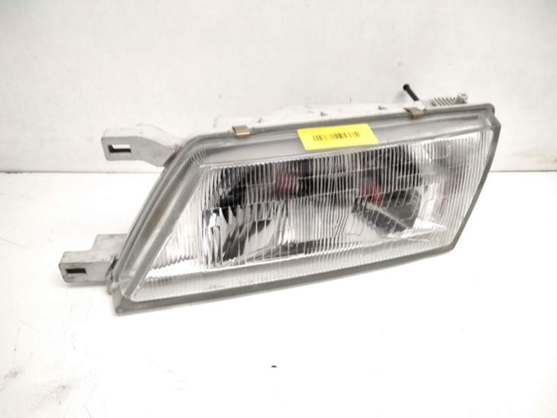 Recambio de faro izquierdo para nissan sunny i (b11) 1.7 d referencia OEM IAM ICHIKOH1522L  