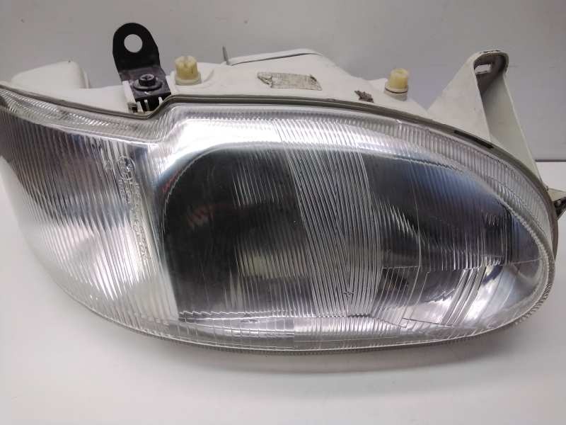 Recambio de faro derecho para ford escort berl./turnier atlanta berlina referencia OEM IAM 1076554  